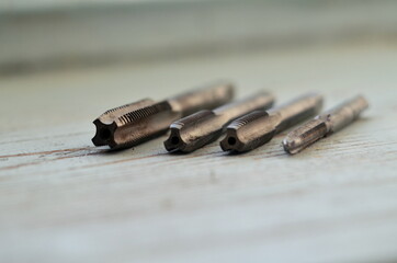 Photo of set of taps on the wood