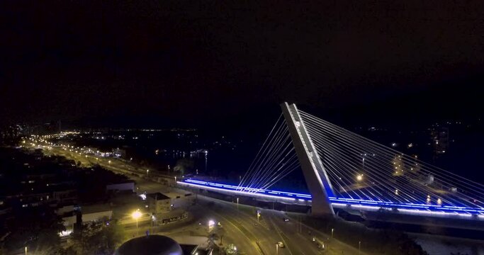 Aerial night view of the subway bridge at Barra da Tijuca in Rio de Janeiro.