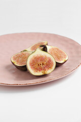 Fig fruit on a plate photo, figs food photo on white background