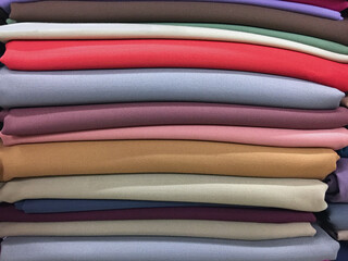 Pastel colored cotton fabric in a shop.