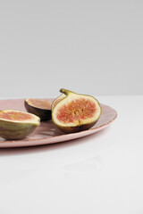 Fig fruit on a plate photo, figs food photo on white background