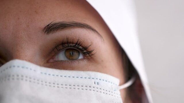 Close up of nurse with mask outside infection room