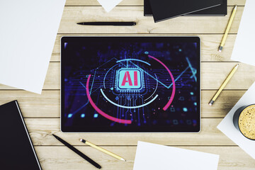 Top view of modern digital tablet screen with creative artificial Intelligence abbreviation. Future technology and AI concept. 3D Rendering