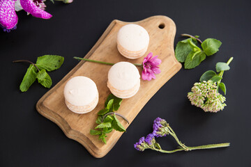 Macarons and mint for dessert - healthy organic summer dessert. Creative atmospheric decoration.