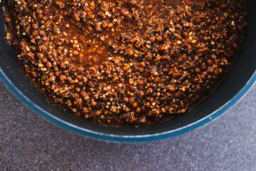 plant-based food, vegan lentil and textured vegetable protein ragu with quinoa in pot