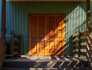 An Entry Door Highlighted By Sunlight