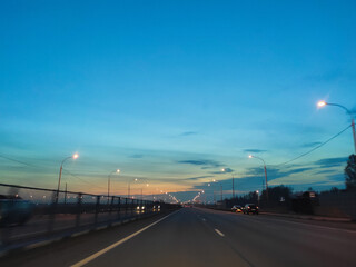 Fototapeta na wymiar auto road at sunset, road evening lighting