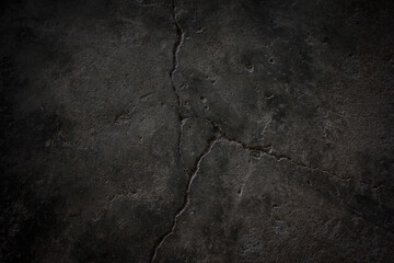 The surface of the cement is cracked with abstract stone.