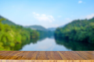 Empty wooden table on nature landscape background