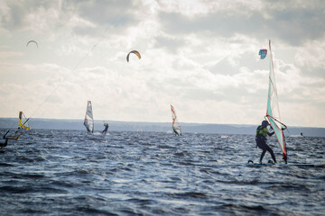 Jastarnia, Poland, July, 8, 2020. Racing windsurfers seen from the  their front.