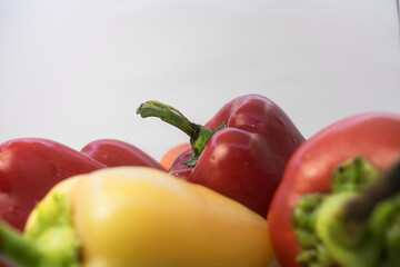 on a light background is a yellow and red pepper with a white free space at the top for the text