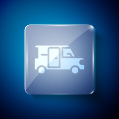 White Minibus icon isolated on blue background. Square glass panels. Vector.