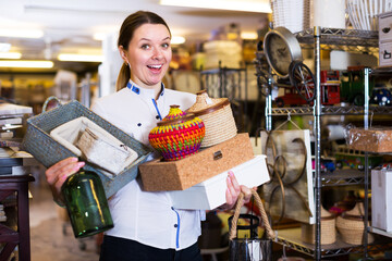 Girl is demonstraiting modern home decoration in furniture store