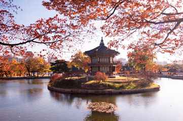 The beautiful autumn red and orange colored palace .