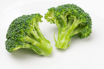 Fresh broccoli with drops of water isolated on white background