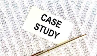 Obraz premium The inscription on the case STUDY business card, next to the pen and books.