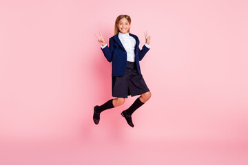 Photo of cute pretty small lady smile jumping raise hands show v-sign having fun classmates school...