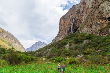 Fototapeta premium Mountain landscape with a river and a waterfall. Summer background. Belogorka gorge, Kyrgyzstan