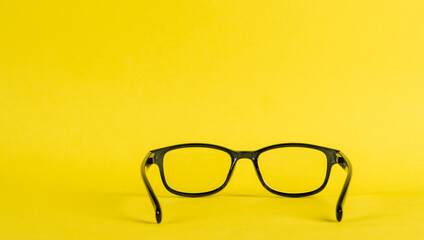 see through glasses against a yellow background