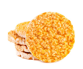 Caramelized rice-corn crispbread, isolated on white background. Sweet puffed whole grain crispbread.