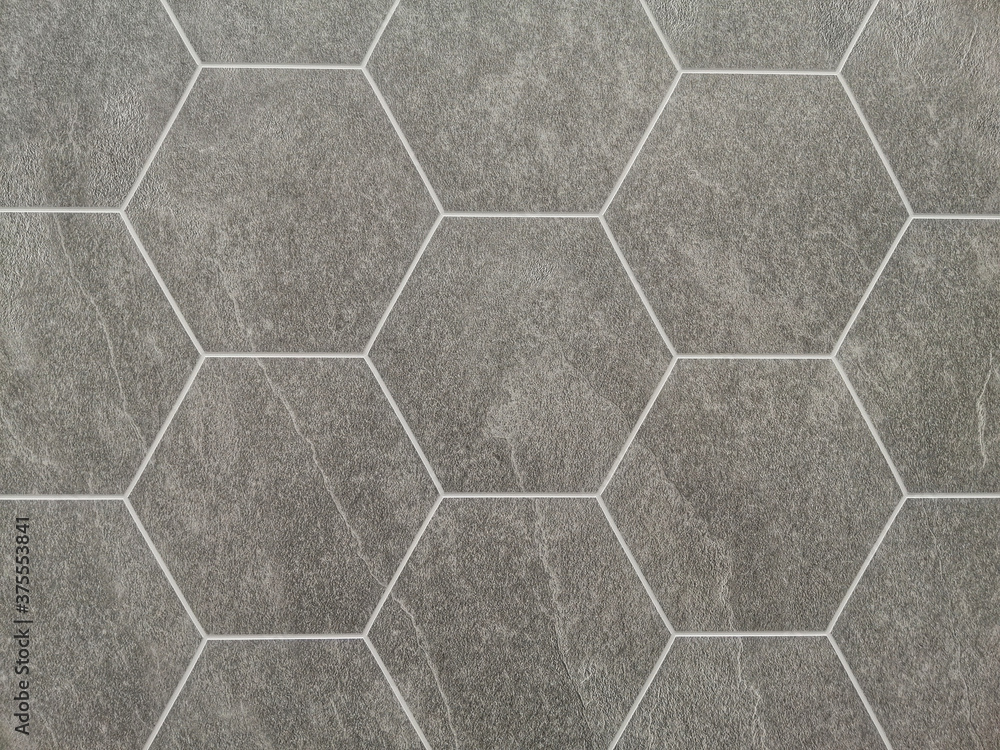 Poster closeup shot of a stone wall with tiles and patterns - copy space