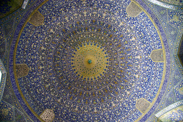 Interior view of the dome in the mosque covered with polychrome tiles