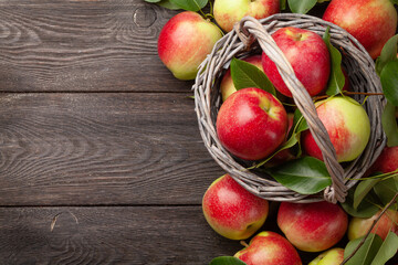 Naklejka na ściany i meble Ripe garden apple fruits in basket