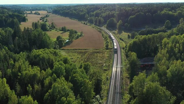 The high-speed intercity train moves on the railroad in the countryside in Espoo, Finland.