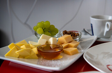 still life with coffee service breakfast on a red tablecloth