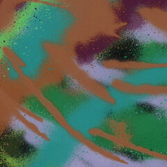 Colorful spray paint ink texture. Graffiti painting on the wall. Street art and vandalism. Digitally airbrushed paper background.