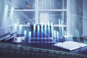 Stock market graph and table with computer background. Double exposure. Concept of financial analysis.