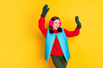 Photo of crazy excited girl enjoy winter season holiday dance raise hands wear trousers jumper...