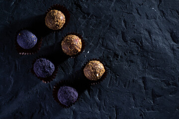 Colored round candies on a dark background