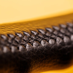 Leather steering wheel black color on the top in the workshop for the repair of car interiors and...