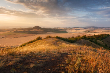Sunset light over Rana hill and Czech Central mountains (Ceske stredohori), Czechia
