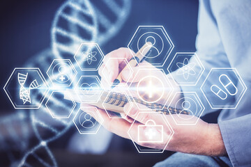 Man's hands working with notes background. Genetic engineering and gene manipulation concept.