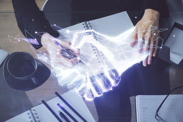 Handshake drawing over hands taking notes background. Concept of success. Double exposure