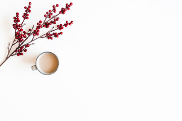 Autumn composition. Cup of coffee, berries on white background. Autumn, winter concept. Flat lay, top view