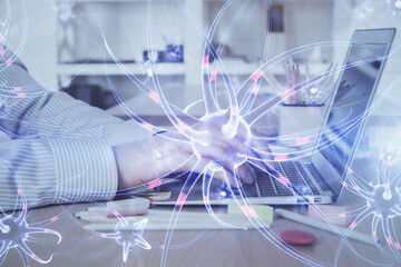 Neuron hologram with man working on computer on background. Education concept. Double exposure.