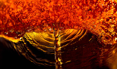 The abstract splashing of carbonated drink.