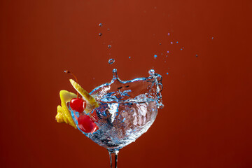 Cocktail with lemon and cherries.