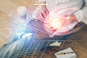 Multi exposure of data internet theme hologram with man working on computer on background. Concept of innovation.