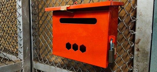 red mailbox on a wall