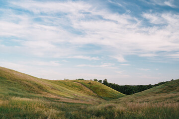 summer landscape with hills and clouds