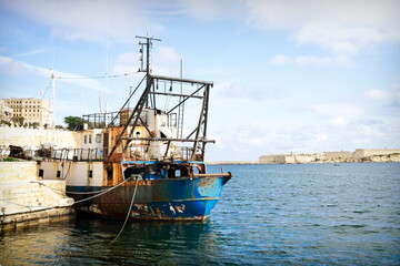 An old fishing ship in the Grand Harbor of Malta