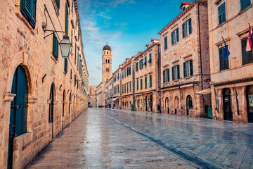 Fototapeta na wymiar Empty street of Dubrovnik. Early morning view of Cathedral. Splendid summer cityscape of Old Town of Dubrovnik, Croatia, Europe. Beautiful world of Mediterranean countries.