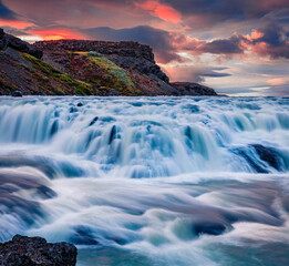 Captivating morning view of popular tourist destination - Gullfoss waterfall. Incredible summer sunrise on Hvita river. Colorful outdoor scene of Iceland, Europe. Beauty of nature concept background.