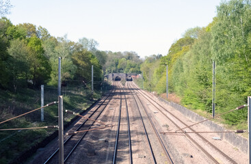 Rail track trail, photographed from bridge oposite two tunnel entrance