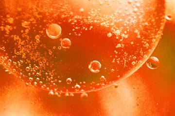abstract light orange background with oil circles . oil bubbles of water close up. fiery circle bubbles background