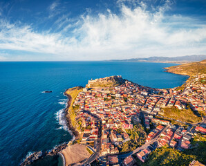Fototapeta premium Superb evening view from flying drone of Castelsardo port. Sunny spring seascape of Mediterranean sea. Aerial view of Sardinia island, Province of Sassari, Italy, Europe.